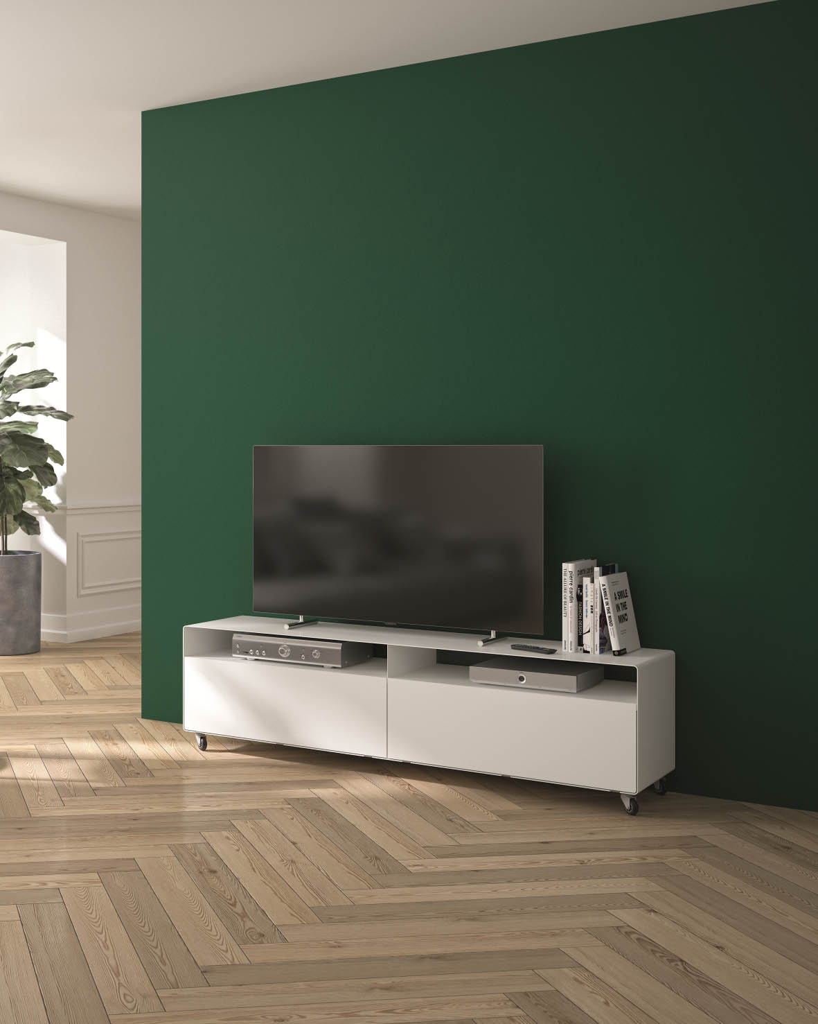 R110 Lowboard weiß von Müller Möbelfabrikation als TV-Board an einer grünen Wand